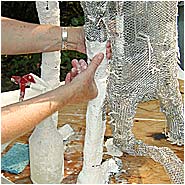Covering mesh with plaster bandages
